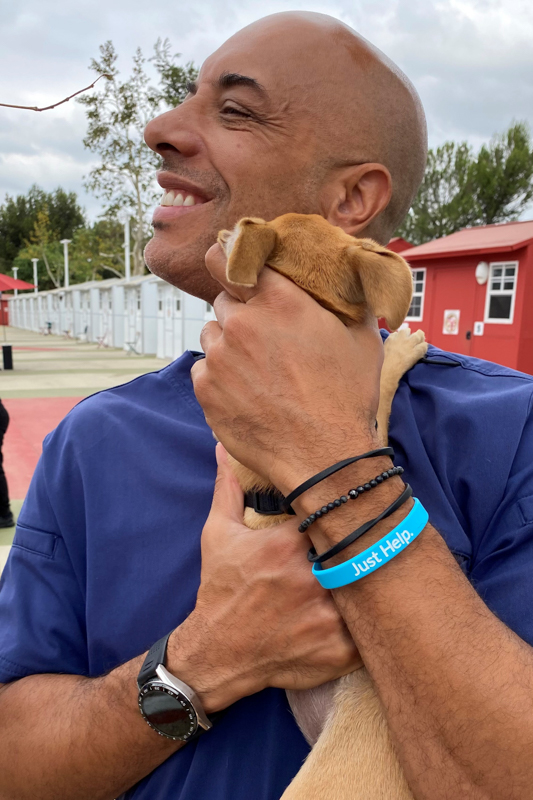 Stewart holding puppy